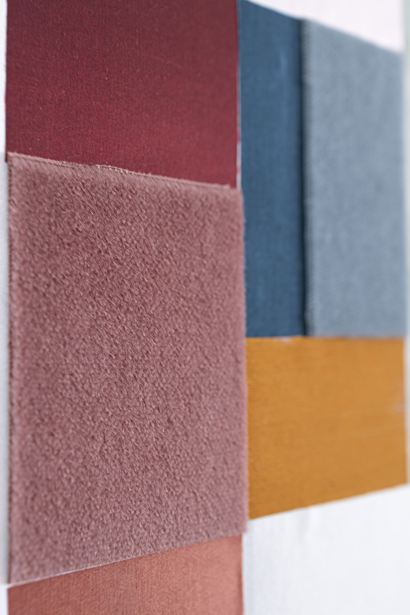 Upcycled textile materials arranged in quiet balance.